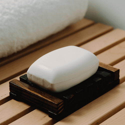 Coconut soap and a wooden soap dish